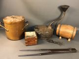 an image of a collection of antique tools and items on a table