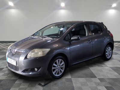a picture of a grey toyota sienna parked in a garage