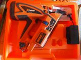 an orange box with a stapler and a stapler in it