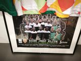 a picture of a picture of a soccer team on the wall