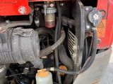 a close up view of the engine of a red truck