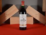 a bottle of wine that is sitting on a table