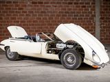an image of a classic car parked in front of a brick wall