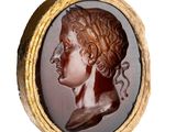 an image of a picture of a woman ' s head in a gold frame