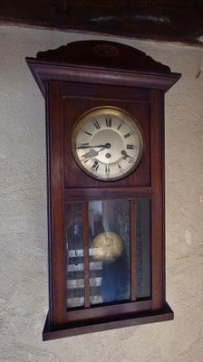 a clock hanging on the wall of a house