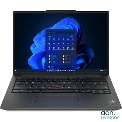 the laptop is open on a white surface with a blue background