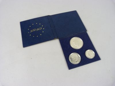 an image of a blue box with four coins in it