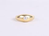 a gold ring with a diamond on top of it