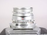 a close up of a camera with a lens attached to it