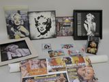 a table with many magazines and pictures on it