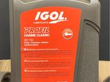 a close up of a bottle of engine oil on a table