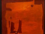 tableau représentant des tons orange et marron sur un mur blanc, encadré de noir