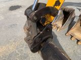 an image of a close up view of a construction vehicle ' s front end