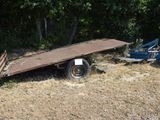 a trailer that is sitting in the middle of a field