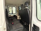 a white van with a black seat in the back of it