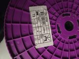 a purple spool that has a label on it