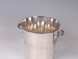 a silver plated ice bucket with handles on a white background