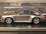 a silver model of a car in a display case