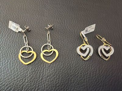 three pairs of gold and silver heart earrings