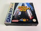 a box of nintendo gameboy games on a table