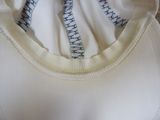 a close up of a white shirt with a black and white design