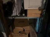 a microwave sitting on top of a shelf in a room