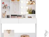 an image of a vanity with a mirror and lights