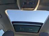 a view of the sunroof from inside of a car
