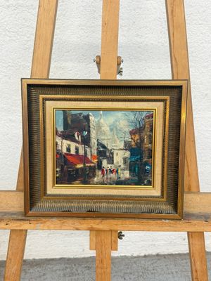 a picture of a painting on an easel with a picture on it