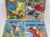four french comic books on a white background