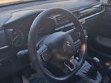 a car with a steering wheel and a dash board