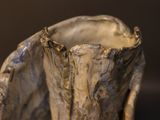 a close up of a vase on a table