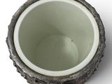a close up of a cup on a white surface