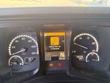 a close up of a car dashboard with various gauges