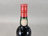 a bottle of wine that is sitting on a table