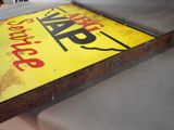 a yellow sign that is on a table