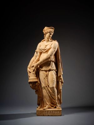 a statue of a woman holding a basket of flowers