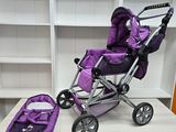 a purple stroller and a purple bag on a table