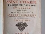 an old book that is open on a table
