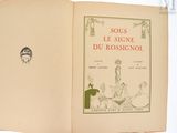 un livre sur lequel figure la photo d'un homme et d'une femme assis à une table