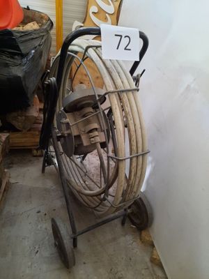 an image of a room with a fan and a cart