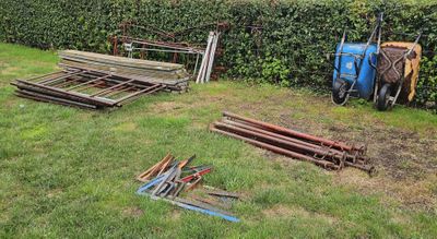 a lot of tools that are laying out in the grass