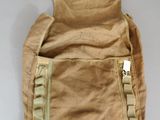 an image of a tan bag with a tag on it