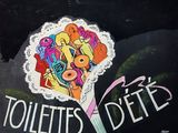 a sign that says toilettes d ' ette on the side of a building