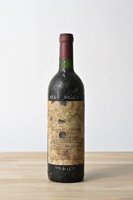 a bottle of wine that is sitting on a table