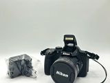 a black camera with a flasher attached to it