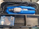 a blue tool box with a drill and other tools in it