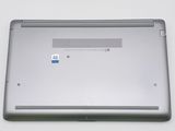 an open laptop computer sitting on top of a white table