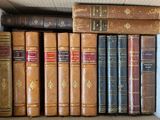 many old books in a box on the shelf