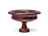 an image of a red marble bowl on a pedestal on a white background